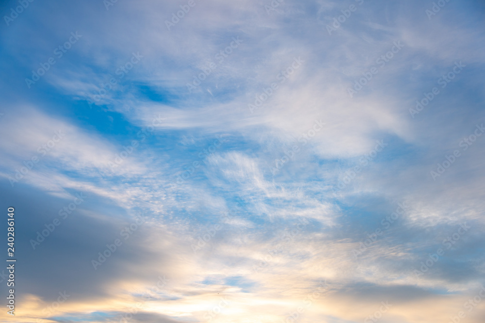 Fototapeta premium Blue sky with white clouds at sunset