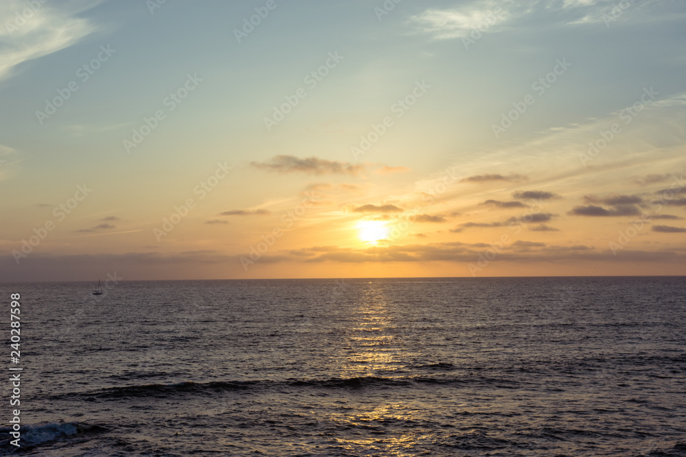 Colorful orange and purple sunset on the Pacific Ocean in La Jolla, San Diego California.