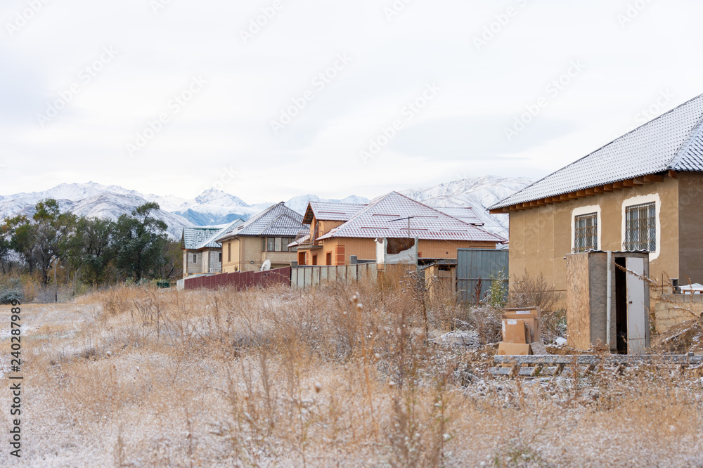 winter house with snow on the roof;