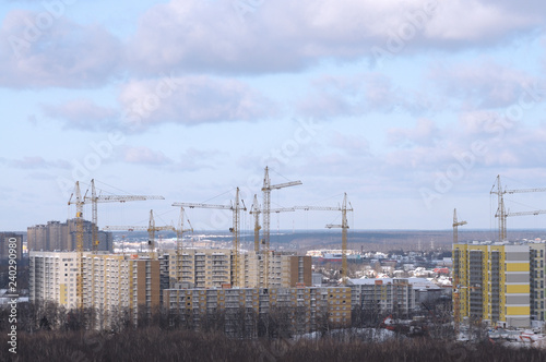 view of houses under construction in winter