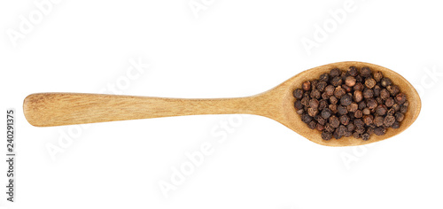 Black peppercorn in a wooden spoon isolated on white background. Top view