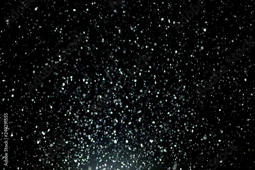 Snowfall on black background