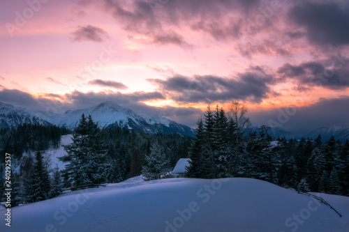 sunset in the snowy austrian mountains 
