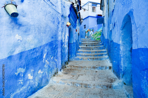 blue street with stair and doors in blue city Chefchaouen in Morocco © sergejson