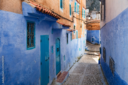 blue and terracotta street in blue city Chefchaouen in Morocco © sergejson