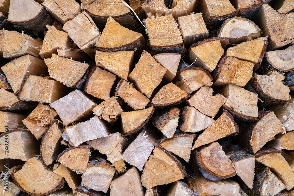 A stack of seasoned firewood logs seen from the front. A stack of seasoned firewood logs seen from the front.