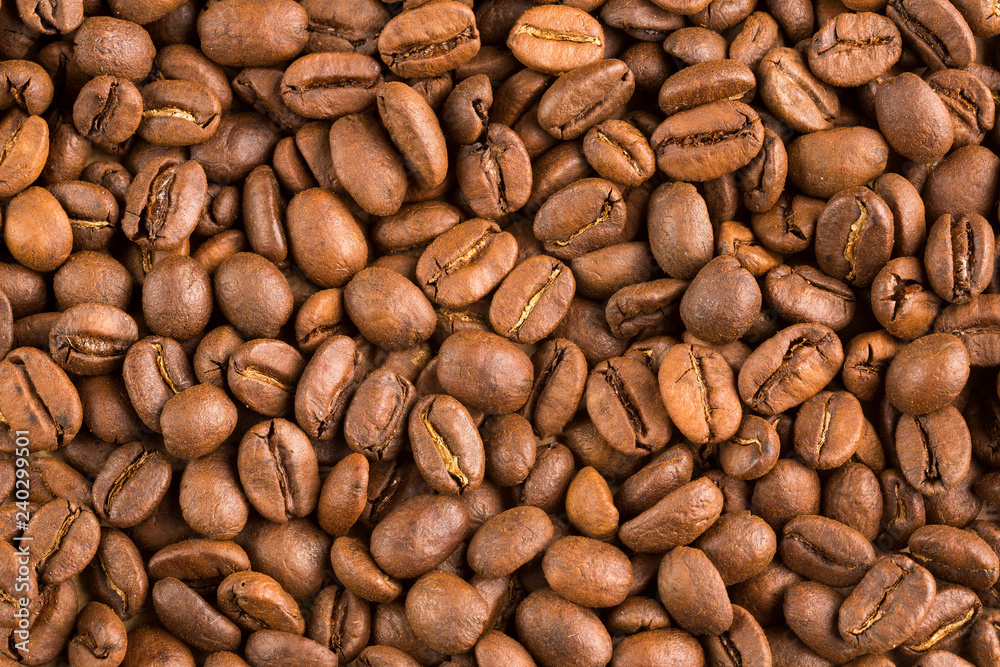 Roasted Colombian coffee beans - Coffea. Top view Roasted Colombian coffee beans - Coffea. Top view