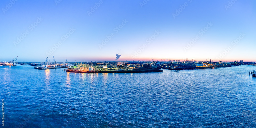 Aerial view of Hamburg Harbor, Germany,  at dusk. The Port of Hamburg (Hamburger Hafen) is a sea port on the river Elbe. It is Germany's largest port and the second-busiest port in Europe.