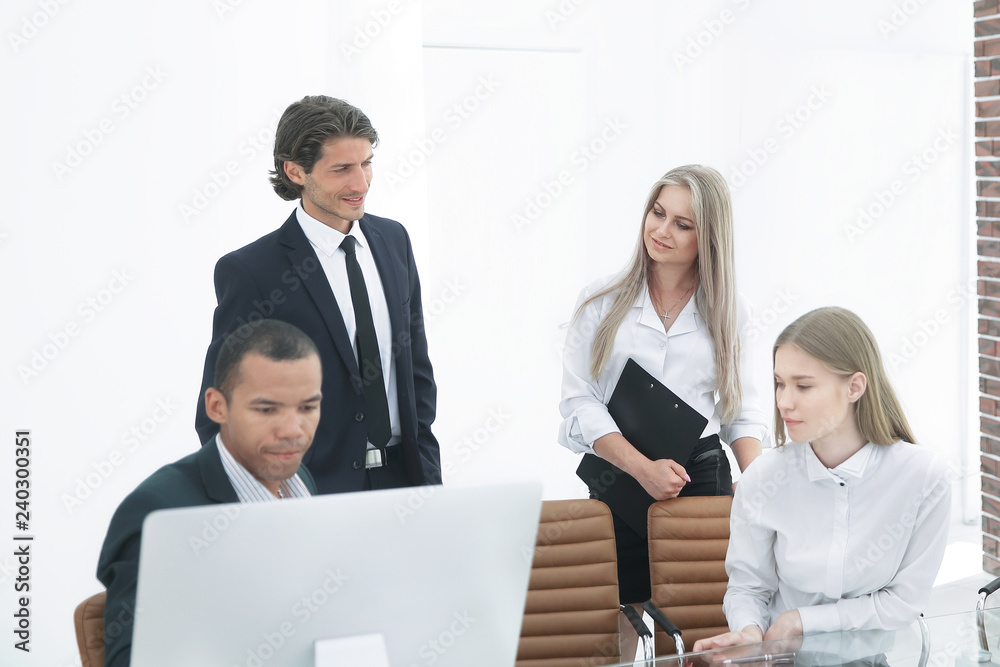 closeup.the employees are talking in a modern office. closeup.the employees are talking in a modern office.