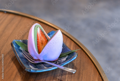 Fresh strawberry Daifuku and Matcha Mochi in a plate. Tokyo sweet Hokkaido Snow Strawberry Daifuku.. photo