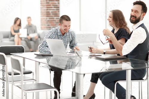 business team discussing new ideas sitting at the office Desk