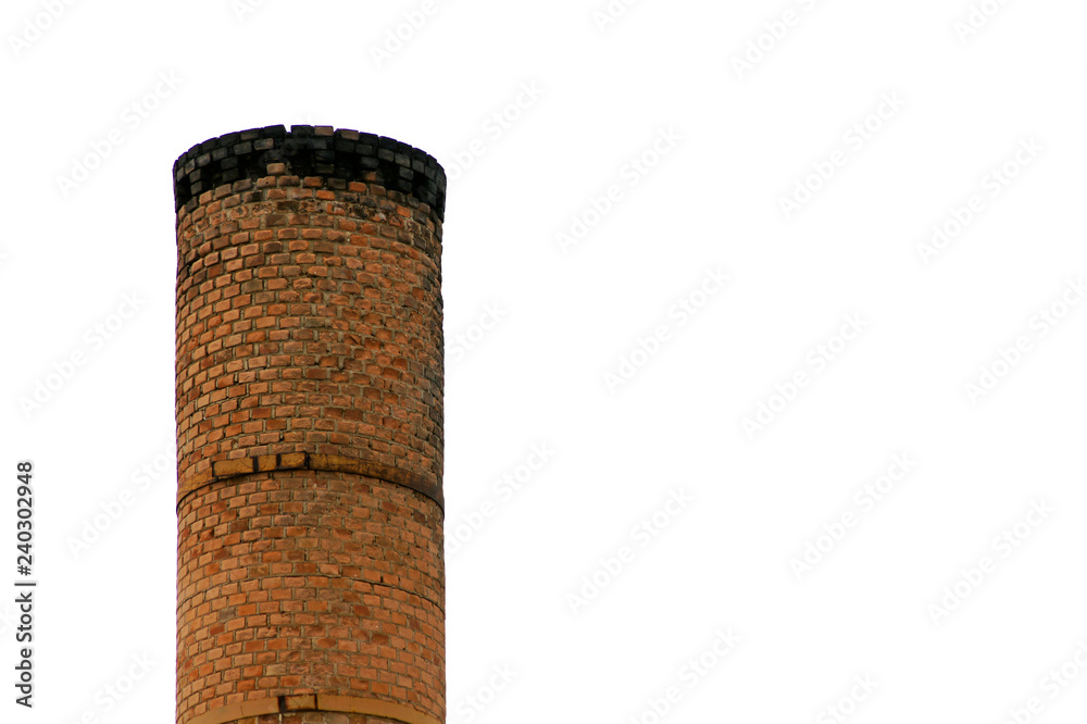 Industrial brick chamine with cloudy sky in background