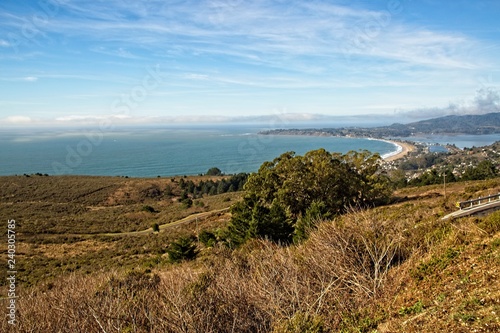 View of Stinson Beach and the Bolinas Lagoon from Mountain Tamalpais, with beautiful blue sky and cloud formation