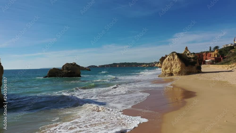 Aerial Atlantic coastline flight over Portugal Portimao beaches, rocks and waves reaching shore Aerial Atlantic coastline flight over Portugal Portimao beaches, rocks and waves reaching shore