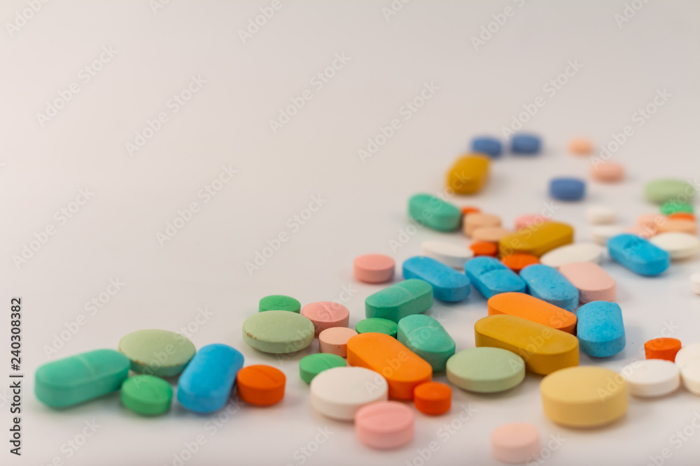 Drugs in the form of medicines. Capsules and tablets of various colors and shapes for human use.