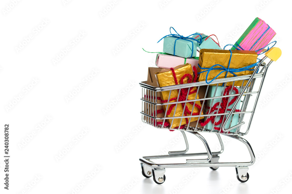 Shopping trolley / cart full of gift boxes isolated on white background with copy space