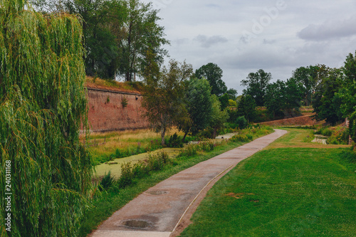 Path between trees and citadel walls, near the Citadel of Lille, France © Mark Zhu