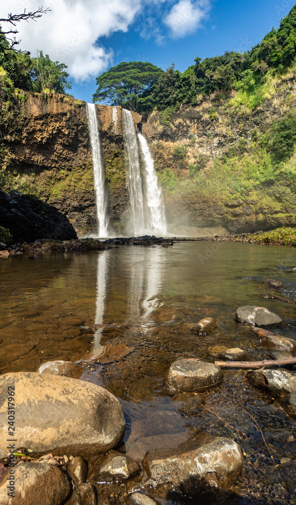 Obraz premium Featured in an 80's TV show, these double-tiered iconic falls, are one of the more recognized sights of the island, Wailua Falls, Kauai, Hawaii