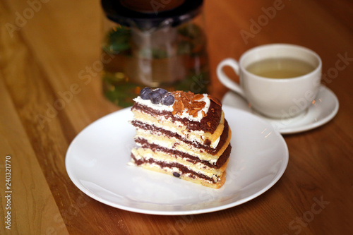 Macro photo of tasty cake with berries and tea