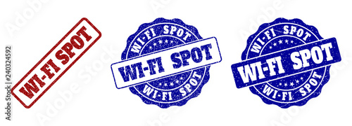 WI-FI SPOT grunge stamp seals in red and blue colors. Vector WI-FI SPOT labels with grunge surface. Graphic elements are rounded rectangles, rosettes, circles and text titles.