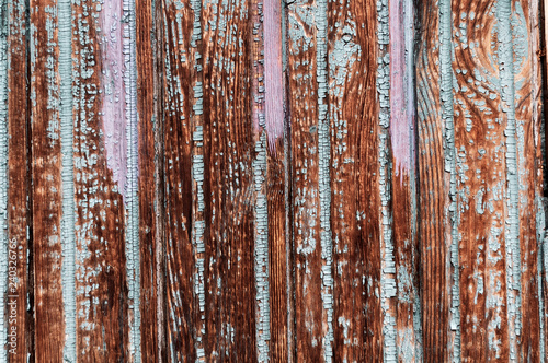 Downed wooden boards with peeling paint