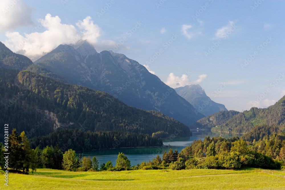 Obraz premium Domegio di Cadore, Italy Beautiful lake in the mountains at sunrise.