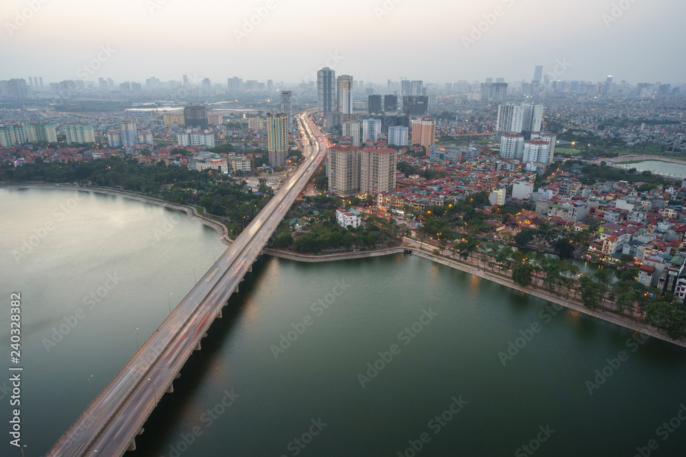 Aerial skyline view of Hanoi city, Vietnam. Hanoi cityscape by sunset period at Linh Dam lake, Hoang Mai district