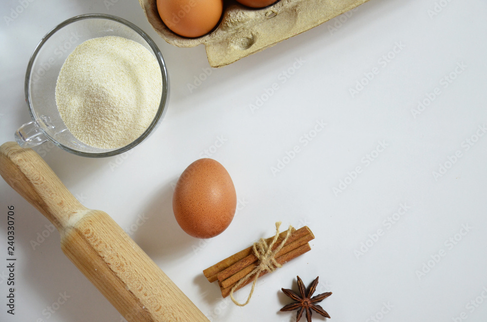 Egg, cinnamon, honey, almond flour, flax seeds, vanilla extract, salt. Ingredients for bread muffins. rolling pin, star of anis on the white background Egg, cinnamon, honey, almond flour, flax seeds, vanilla extract, salt. Ingredients for bread muffins. rolling pin, star of anis on the white background