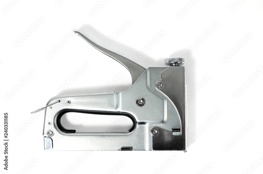 Metal Nickel plated stapler gun on white background, isolate. Metal Nickel plated stapler gun on white background, isolate.