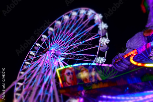 Abstract of colorful Ferris wheel at night at the county fair