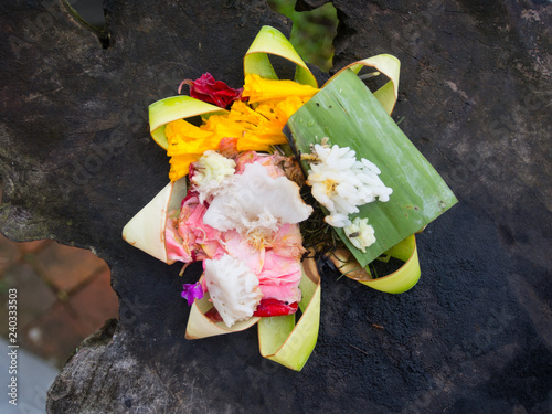 Canang sari is one of the daily offerings made by Balinese Hindus to thank the Sang Hyang Widhi Wasa in praise and prayer photo