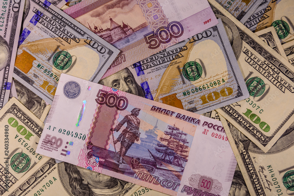 Obraz premium Background of the different american and russian banknotes