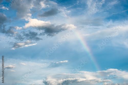 Arch rainbow natural phenomenon with clouds in sky © Mumemories