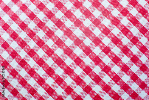 red fabric texture of checkered picnic blanket