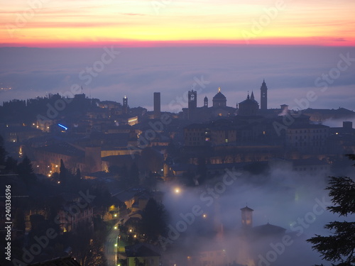 Bergamo, one of the most beautiful city in Italy. Lombardy. Amazing landscape of the fog rises from the plains and covers the old town at sunrise