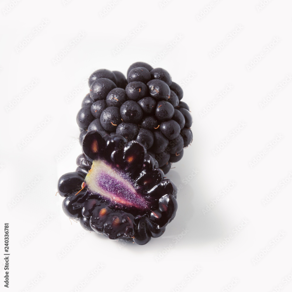 Large fresh BlackBerry isolated on white background. Large fresh BlackBerry isolated on white background.