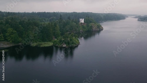 Aerial survey Mon Repos park in Old Vyborg, Russia, Monrepos north footage. Aerial footage forest panoramas foggy thick north forest, Island the Dead Mon Repos park. aerial video coniferous, pine tree photo