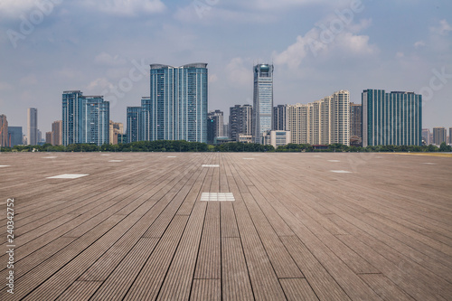 Panoramic skyline and modern business office buildings with empty road empty concrete square floor