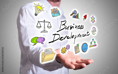 Business development concept above a human hand