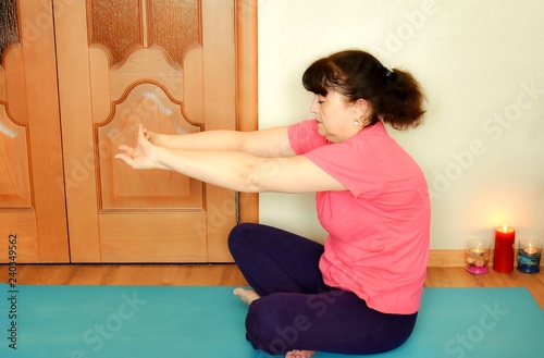 woman practicing yoga at home