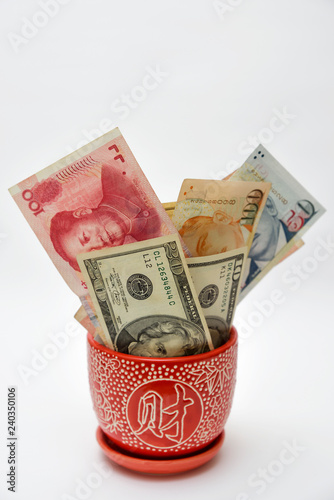Vase with overflowing Paper Currency.
