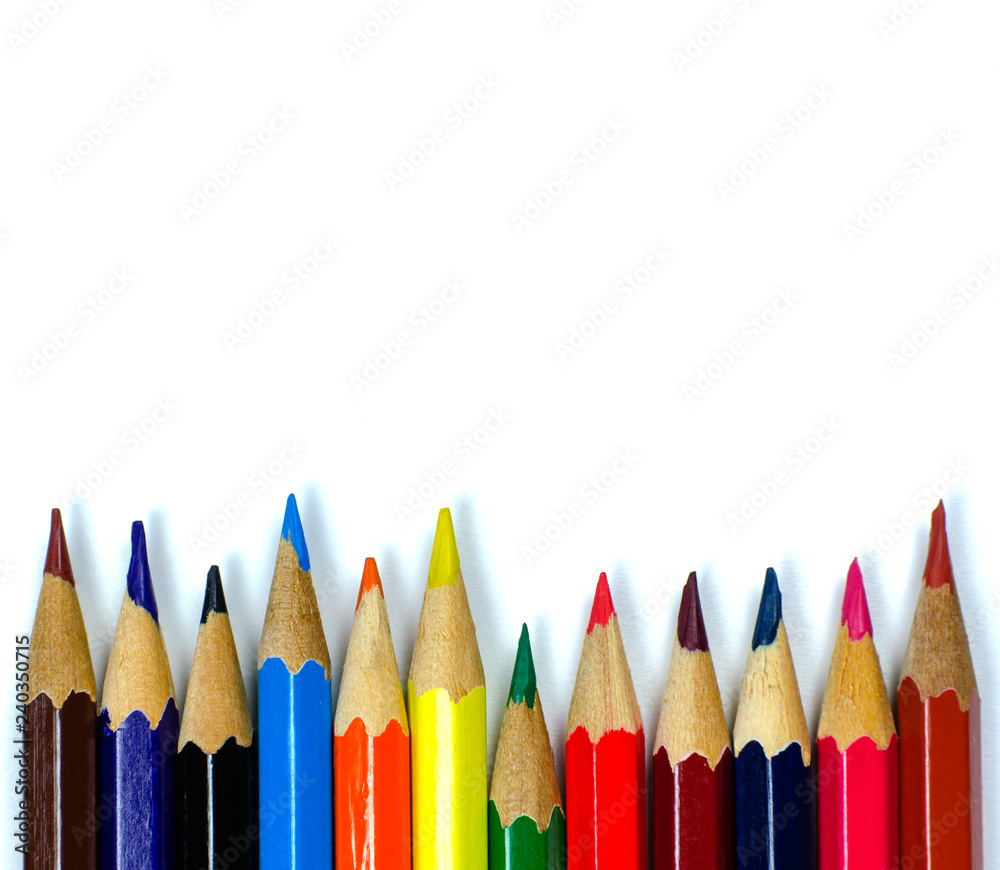 Multi colored pencils on white background Multi colored pencils on white background
