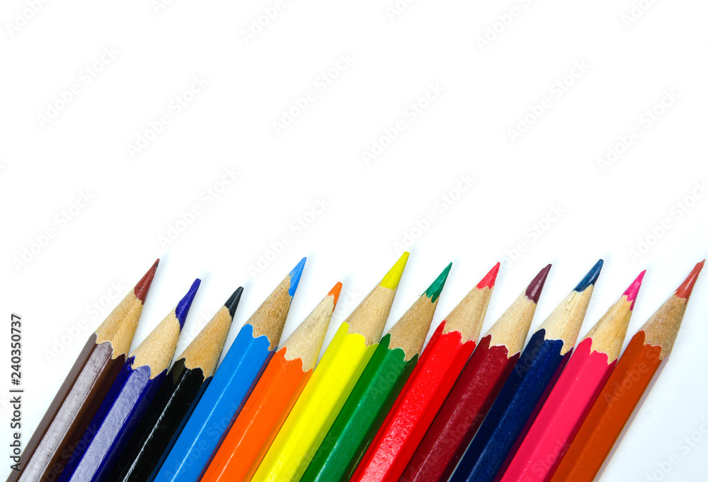 Multi colored pencils on white background Multi colored pencils on white background