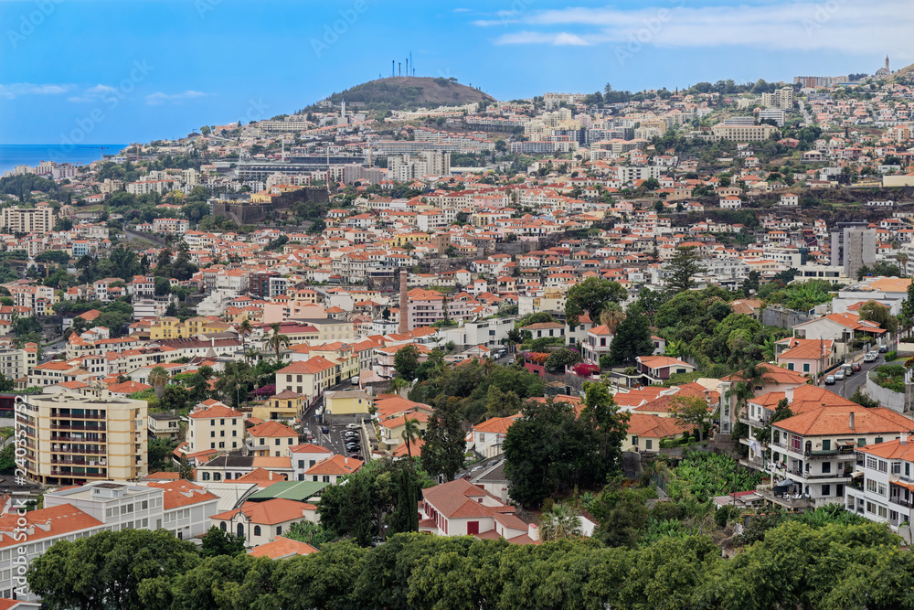 Panoramic at residential district in Funchal against blue sky. Portuguese island of Madeira