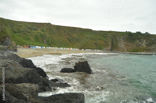 Luarca Beach With Its Picturesque And Colorful Changing Rooms In The Background. July 30, 2015. Travel, Nature, Vacation. Luarca, Asturias, Spain. photo