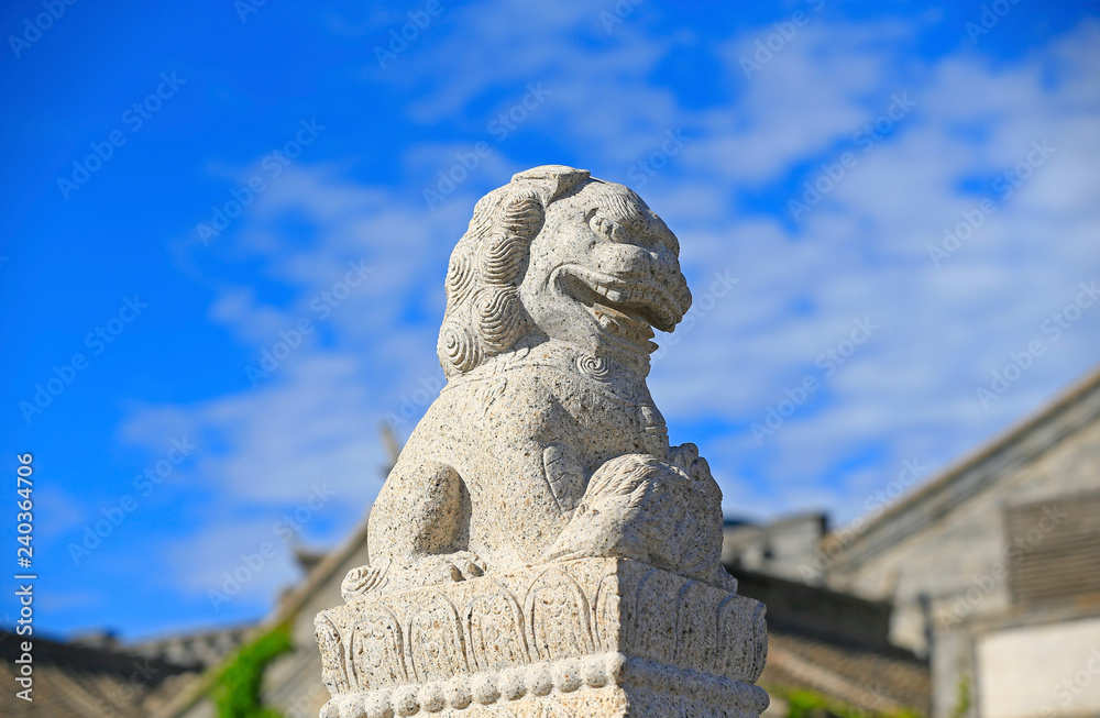A stone lion on a stone bridge in ancient China