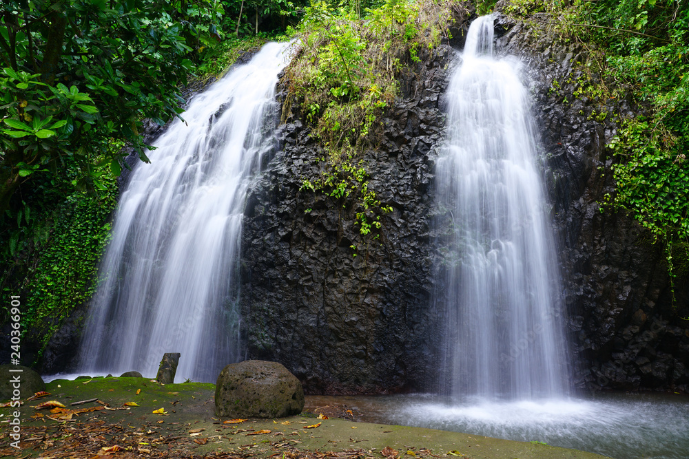 View of a cascading waterfall in Tahiti, French Polynesia View of a cascading waterfall in Tahiti, French Polynesia