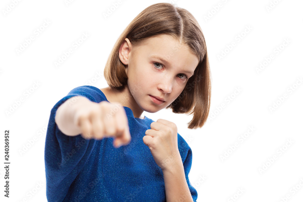 Cute teen girl with fists, close up, isolated on white background Cute teen girl with fists, close up, isolated on white background