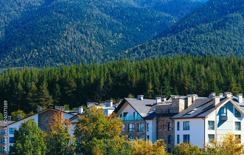 Wallpaper Mural Abstract modern mountain hotel in a forest. Alpine village, green hills. Torontodigital.ca