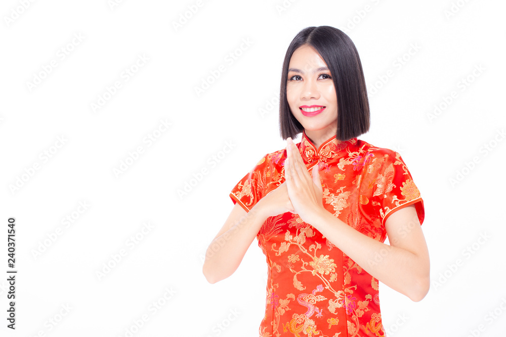Chinese woman wear qipao for chinese new year day with attractive smile, isolated on white background Chinese woman wear qipao for chinese new year day with attractive smile, isolated on white background
